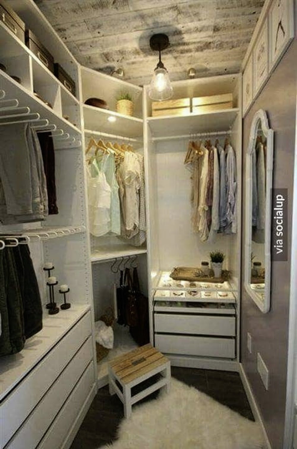 walk in closet with white corners and drawers and shelves and hanging rods