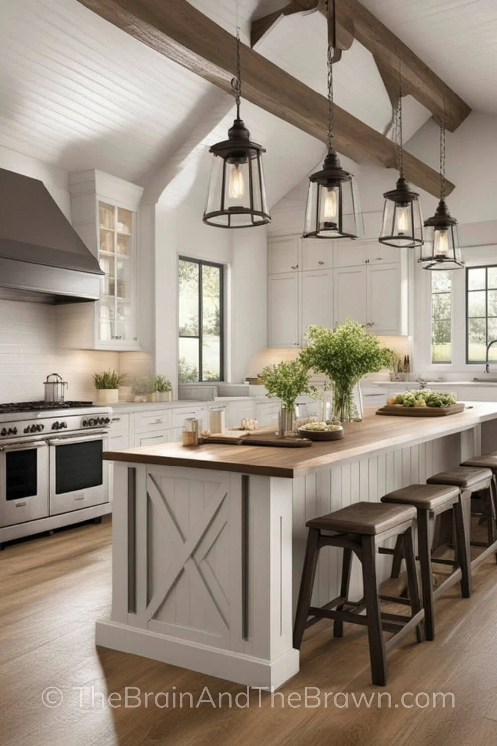 A modern farmhouse kitchen with white kitchen cabinets and large island with wood bar stools. There are large black windows and black pendant lighting hangs down from wooden beams