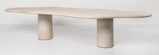 A white custom table with a unique shaped table top and double round base. 