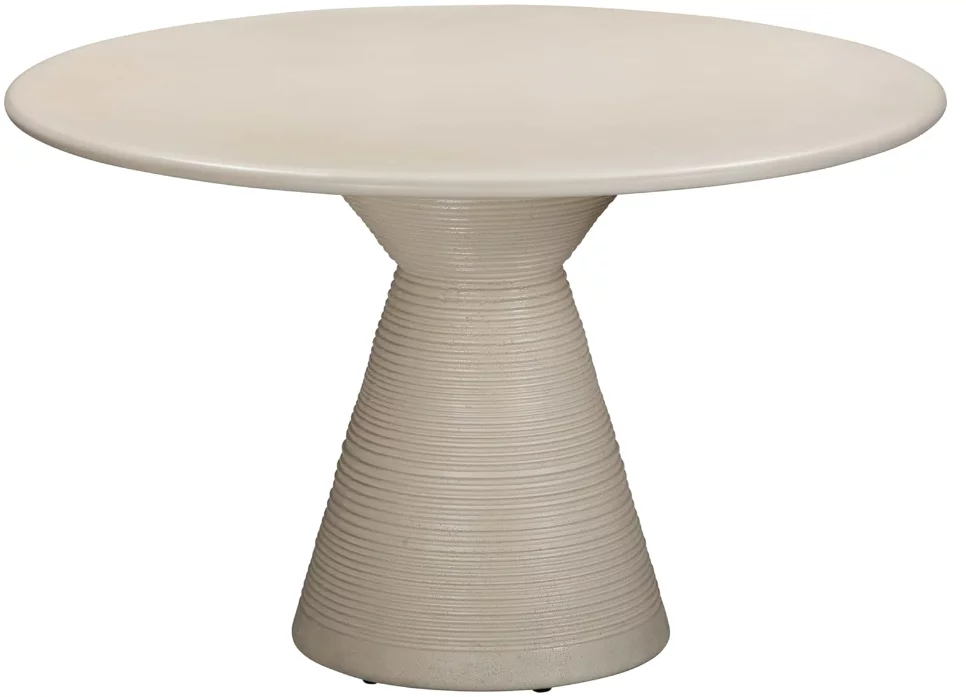 A white, round plaster dining table with singular textured base. 