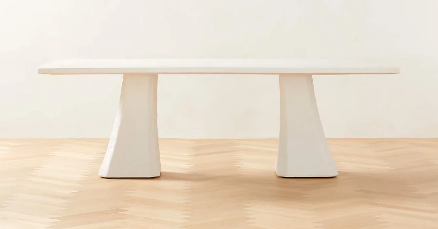 White, custom dining table with double base. 