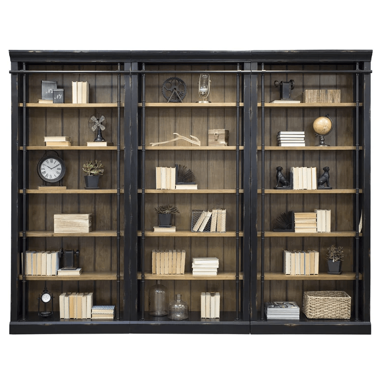 A set of three bookcases with black facings and natural wood background