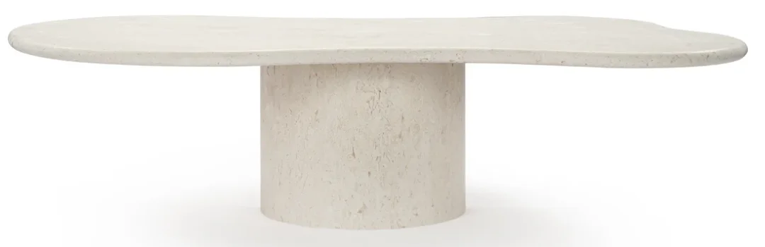 A white plaster dining table with a unique rounded table top and a round single leg base