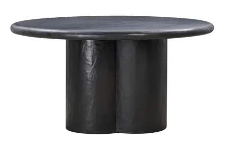 A round, black, plaster dining table with a round base