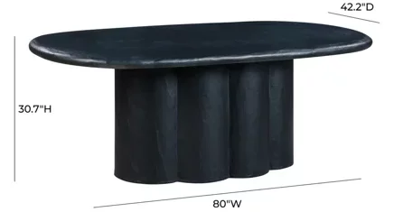 A black, oval, plaster dining table with a thick plaster base