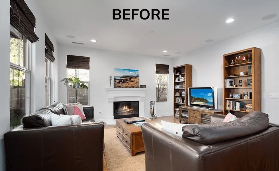 A before photo of a clients living room with fireplace. All of the furniture is pushed up against the walls without a clear walkway of where to walk.