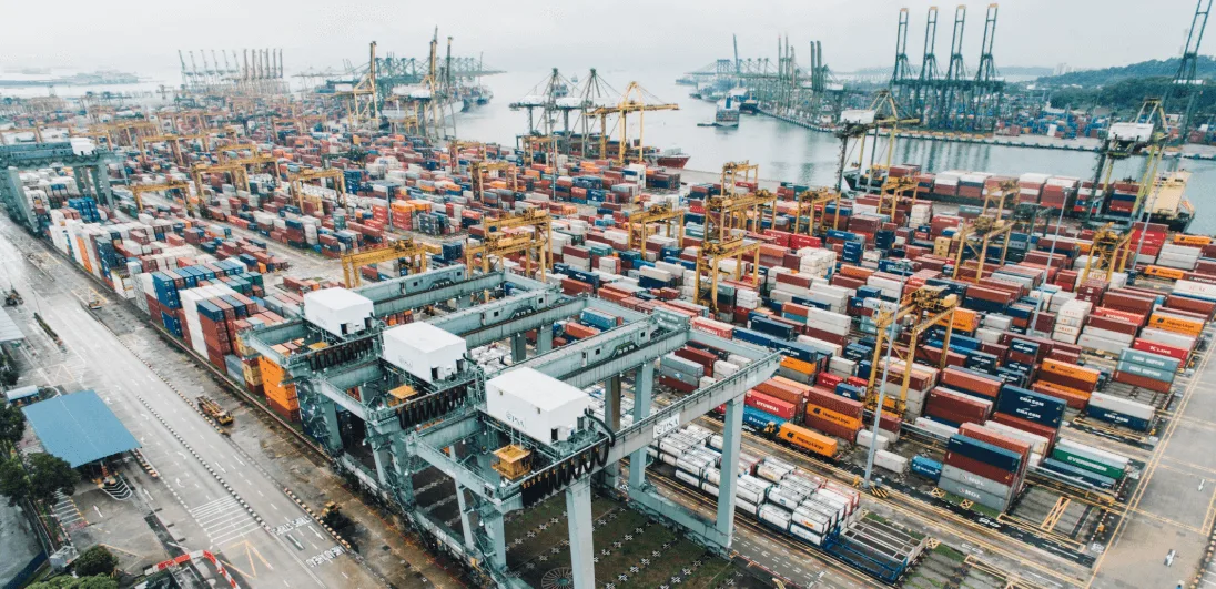 An ocean port lined with shipping containers