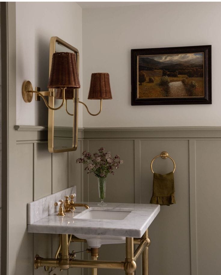 A bathroom with a half wall panelling idea painted a grey and the rest of the wall is white