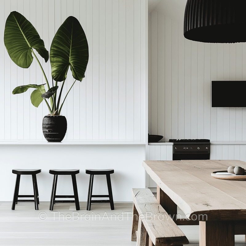 A kitchen with a vertical wall paneling idea of white vertical shiplap on the wall and as the backsplash