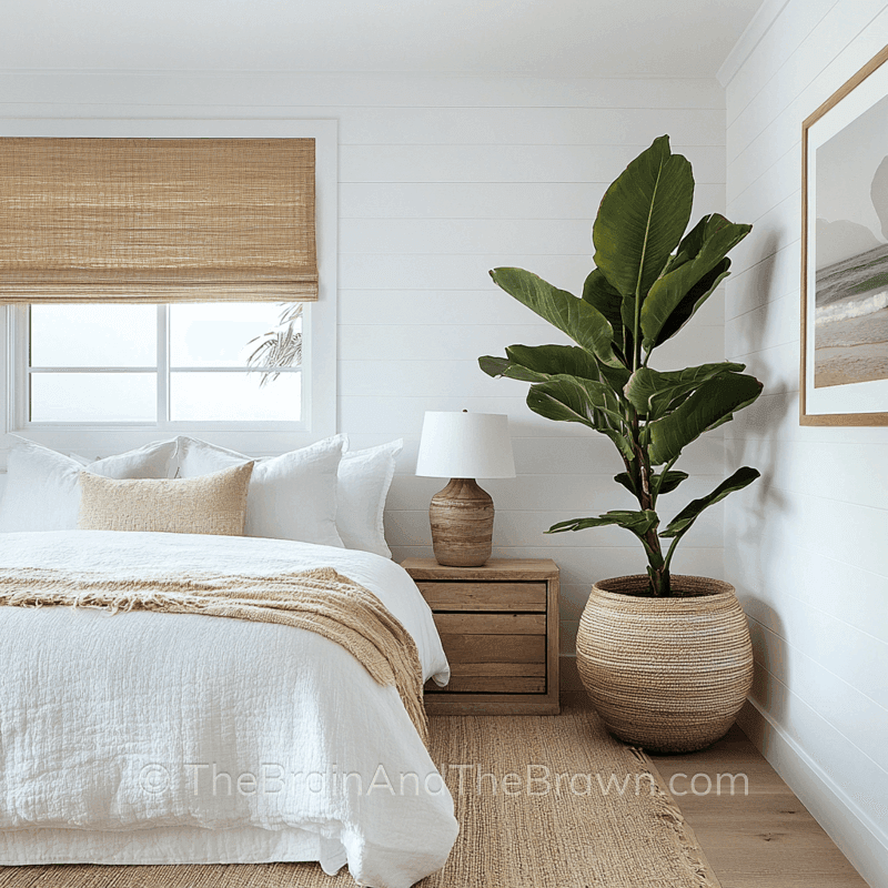 Bedroom with a window above the bed and white horizontal shiplap wall panelling 