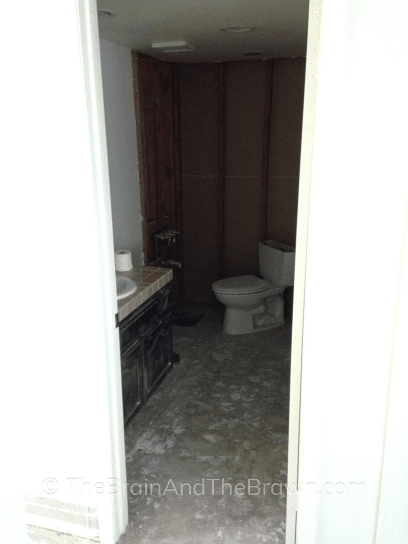 small bathroom being renovated, tile demolished