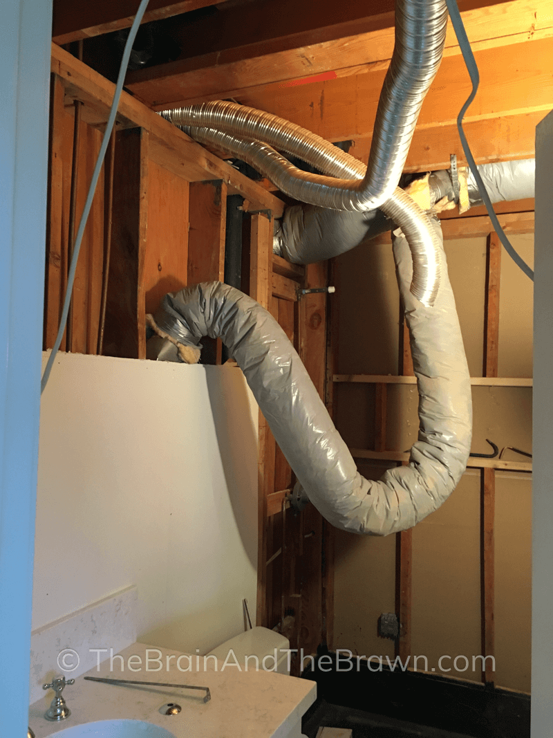 An inside look of the inside of the lowered ceiling in a bathroom