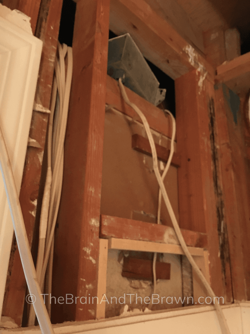 A photo showing an inside look of what was behind the walls while raising the ceiling height