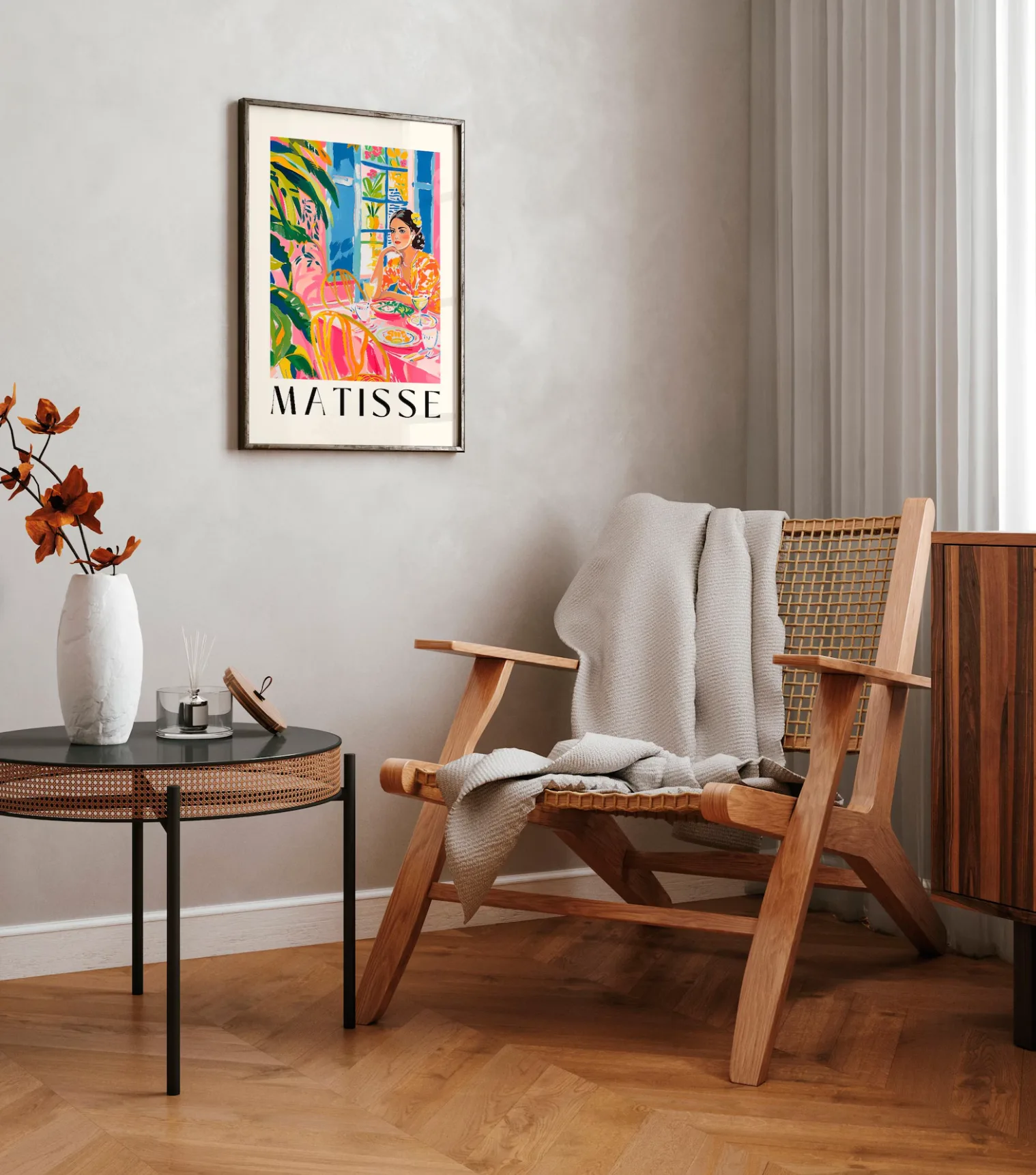 A corner of a room with a wooden chair and Spanish modern wall art hanging on the wall 