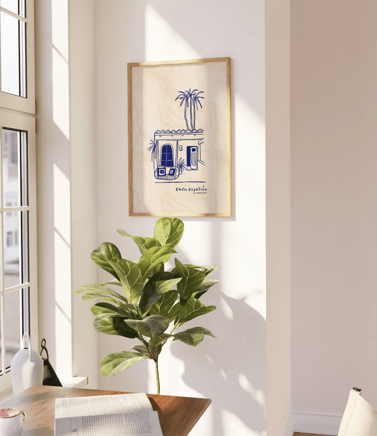 A corner of a home with a modern Spanish artwork hanging on the walls