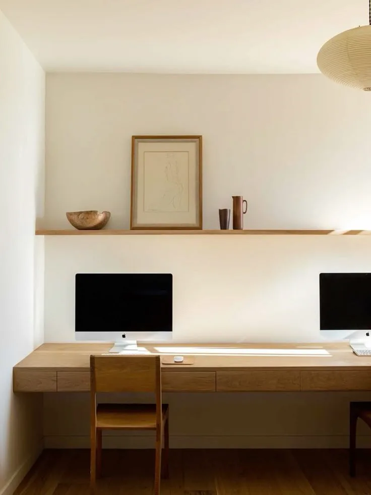 white and wood floating desk in home office, minimalist style with a floating shelf