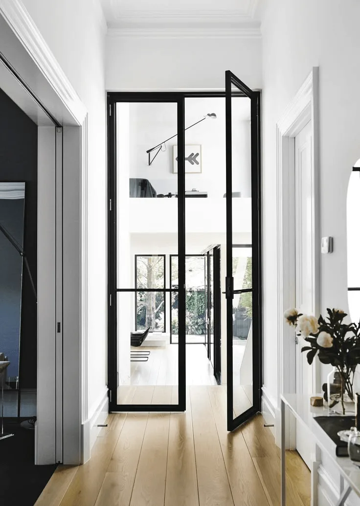 modern black office doors in white beach house