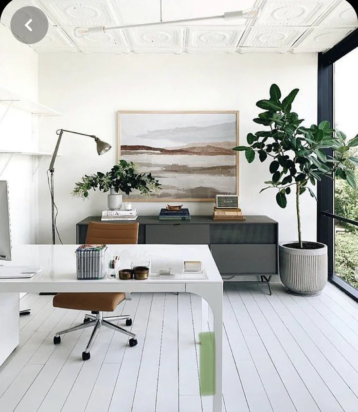 casual home office with white planks, coastal style with artwork