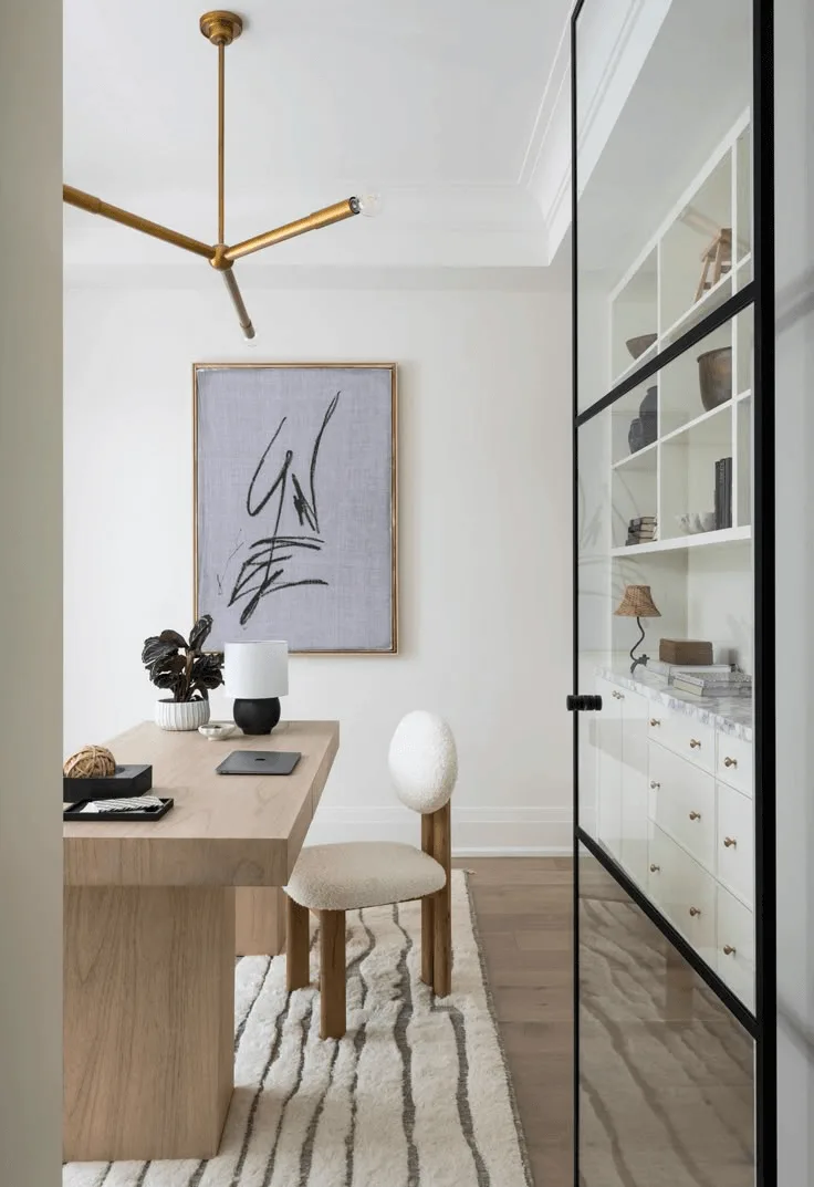 modern home office with floor to ceiling bookshelves, modern lighting