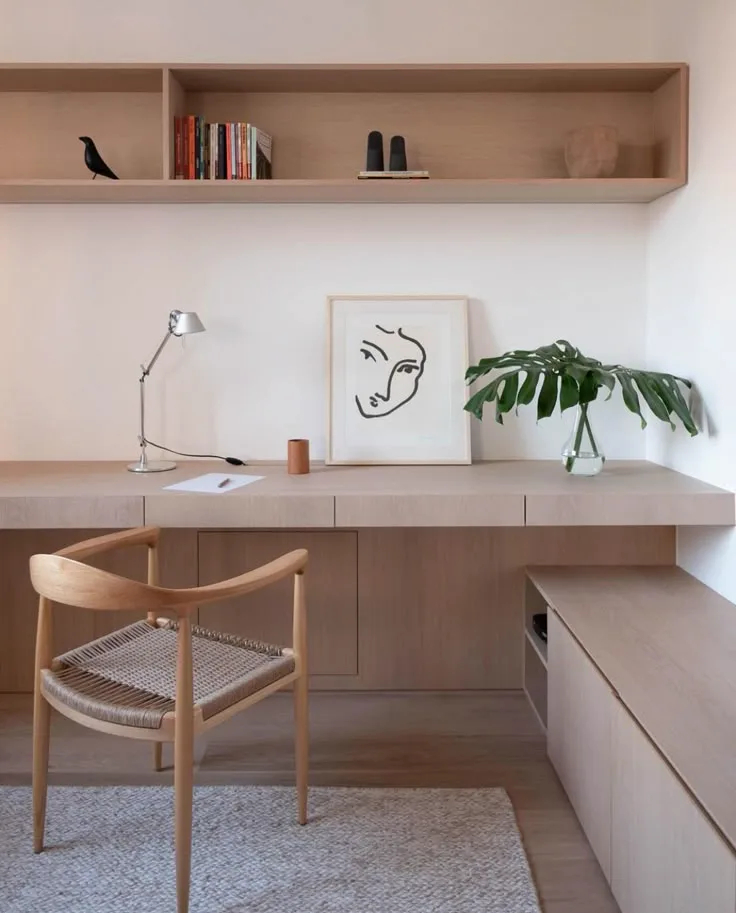 home office design idea with wood floating shelves and floating desk with modern art