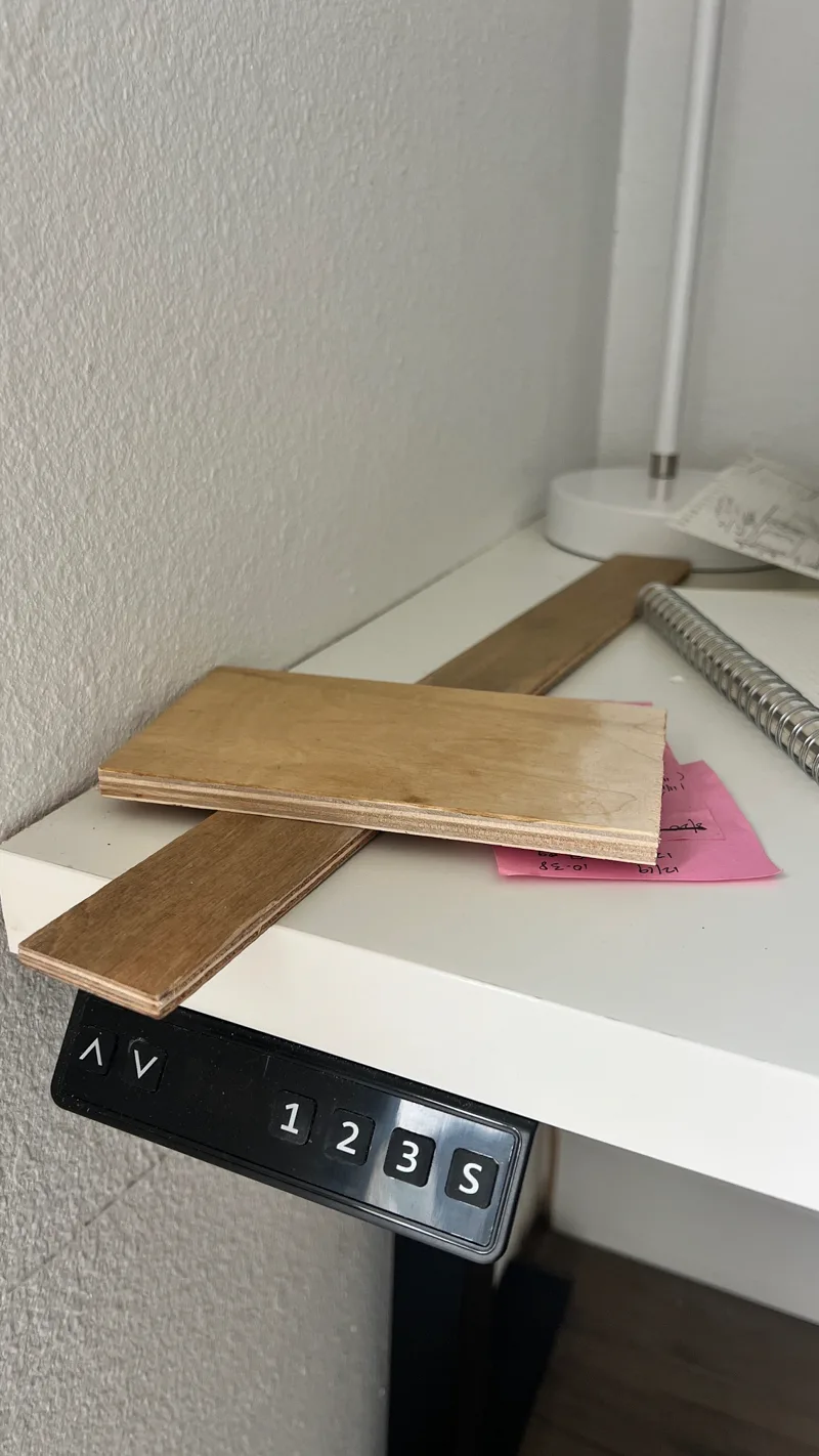 a desk with wood stain samples on it