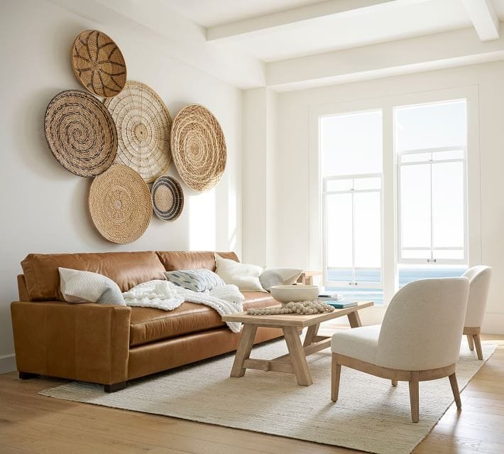 baskets as wall decor on a big empty living room wall
