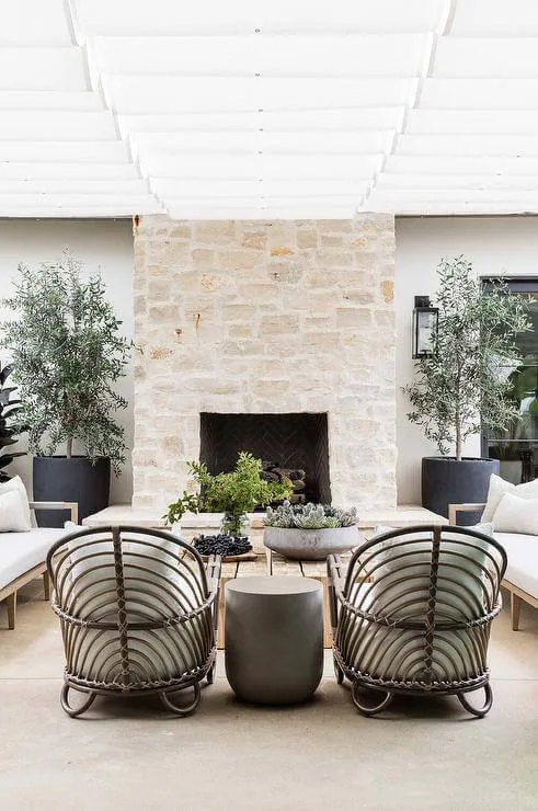 a stone firpleace in outdoor living room