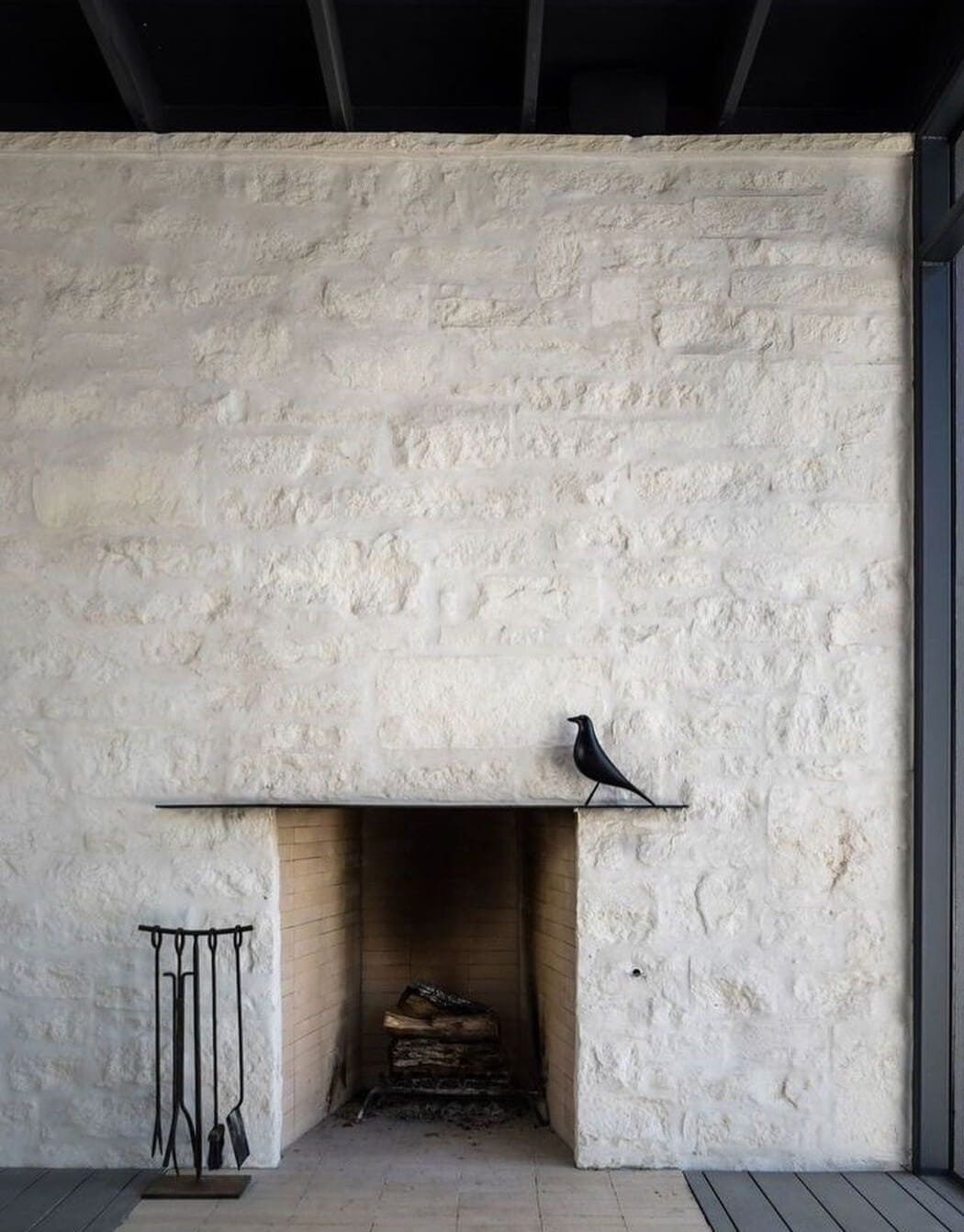 a white stone fireplace in old world style, minimalist 