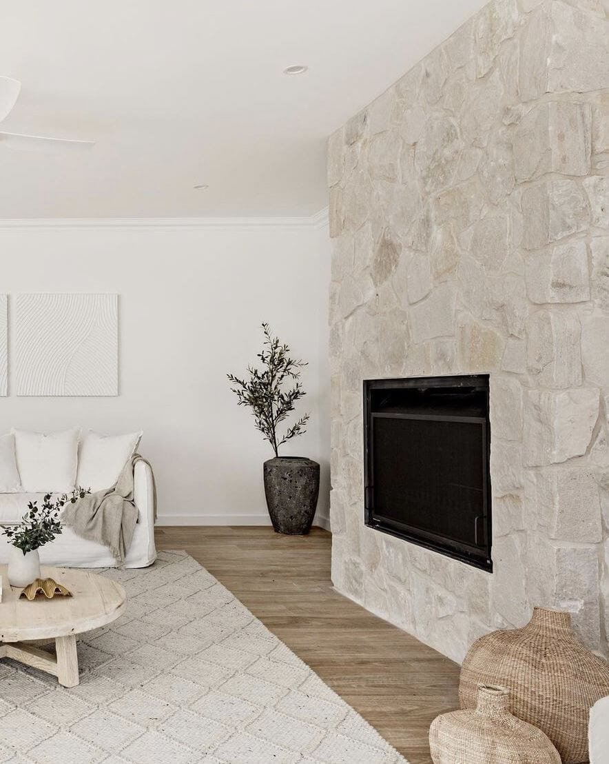 a calming living room with stone fireplace idea design on wall