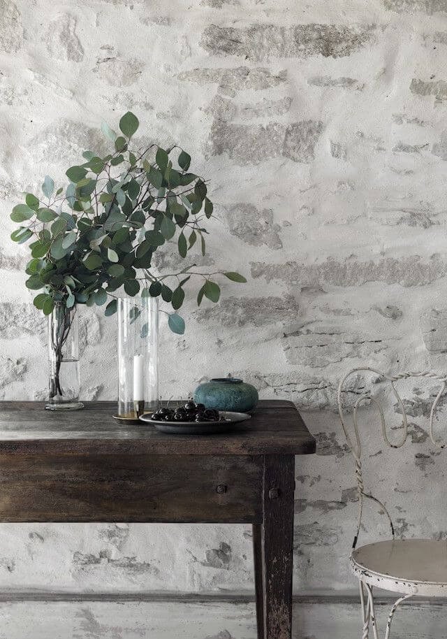 a thick over-mortared stone veneer wall