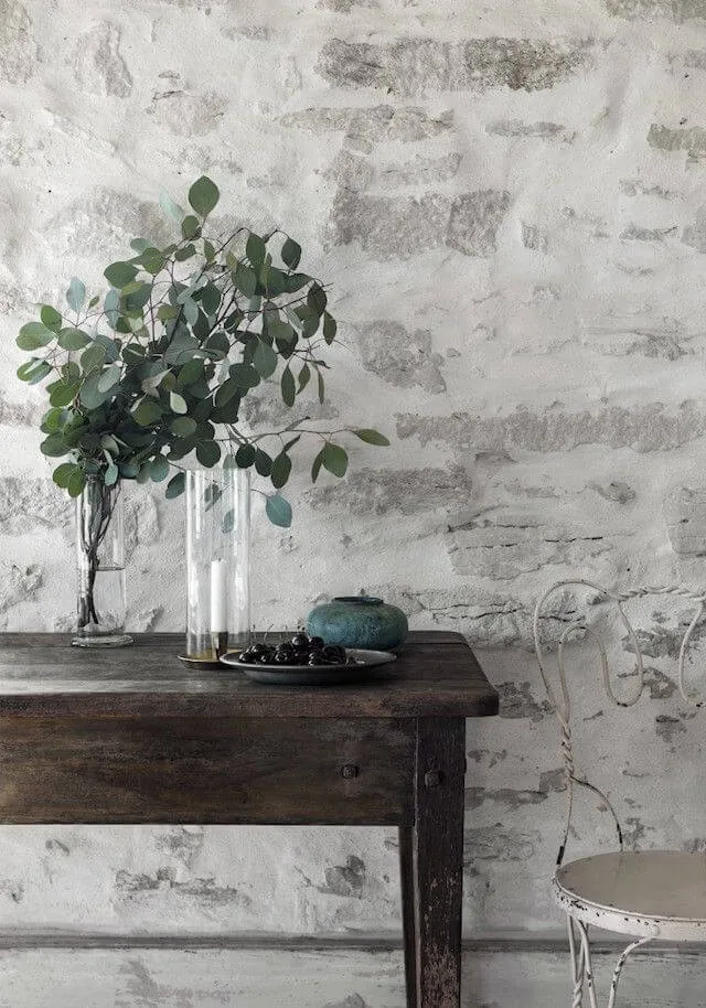 a thick over-mortared stone veneer wall